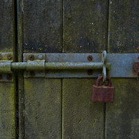 Buy canvas prints of  the rusted padlock by john english