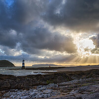 Buy canvas prints of Sun Rays Over Penmon Lighthouse And Puffin Island by Phil Durkin DPAGB BPE4