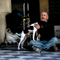 Buy canvas prints of Homeless man with dog by Jose Manuel Espigares Garc