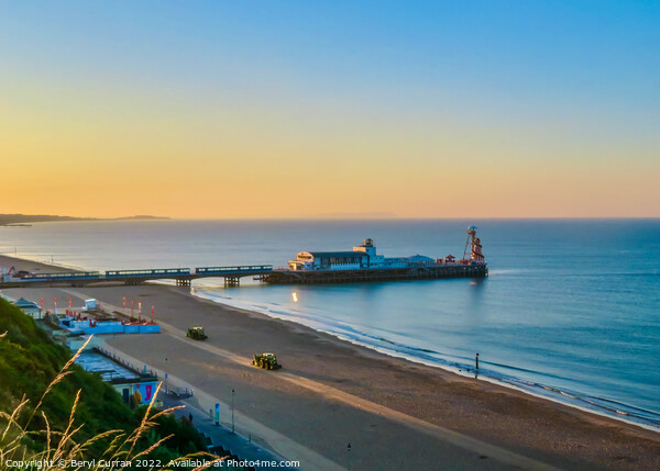 A Glowing Sunrise over Bournemouth Beach Picture Board by Beryl Curran