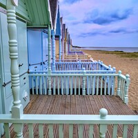 Buy canvas prints of  Mersea Islands Charming Pastel Beach Huts  by Beryl Curran