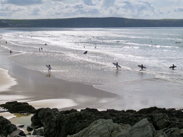 Riding the Waves at Woolacombe Beach Picture Board by Beryl Curran
