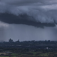 Buy canvas prints of The City of Manchester under stormy skies by John Finney