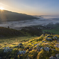 Buy canvas prints of Sunrise over Wansfell Pike next to Lake Windermere by John Finney
