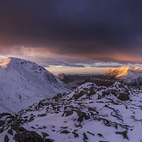 Buy canvas prints of  Cumbrian mountains winter summit sunset panoramic by John Finney
