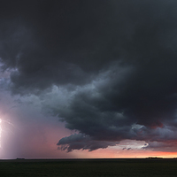 Buy canvas prints of Kansas thunderstorm at sunset, panoramic by John Finney