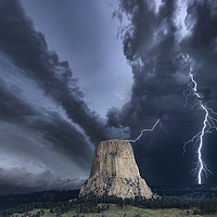 Buy canvas prints of Storm over The Devils Tower by John Finney