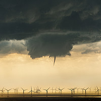 Buy canvas prints of A funnel cloud over a wind farm  by John Finney