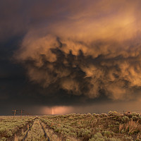 Buy canvas prints of Distant Lightning with sunset storm clouds by John Finney