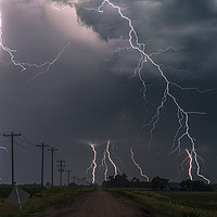 Buy canvas prints of Extreme lightning with Fireflys by John Finney