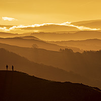 Buy canvas prints of Two people stand on a mountain  by John Finney