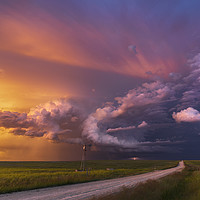 Buy canvas prints of Thunderstorm sunset over Montana by John Finney