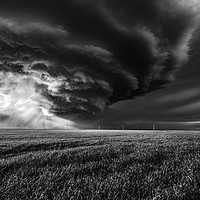 Buy canvas prints of Sunlight through a storm. black and white by John Finney