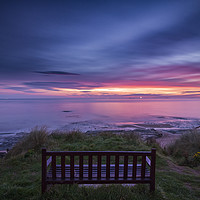 Buy canvas prints of Bamburgh beach with a lone bench by John Finney