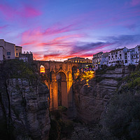 Buy canvas prints of Ronda Puente Nuevo sunset, Spain.  by John Finney