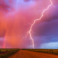 Buy canvas prints of Monsoon sunset lightning with a rainbow by John Finney