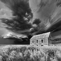 Buy canvas prints of Abandoned Schoolhouse with a Storm, Colorado  by John Finney