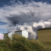 Buy canvas prints of Kent Beach Huts with storm clouds by John Finney