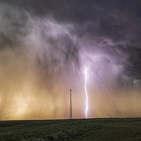 Buy canvas prints of Massive Lightning Bolt next to a cell tower, USA. by John Finney