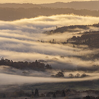 Buy canvas prints of Lake Windermere flowing fog by John Finney