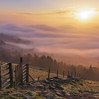 Buy canvas prints of Glowing sunrise above fog by John Finney