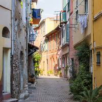 Buy canvas prints of Street with sunshine in Villefranche-sur-Mer by ELENA ELISSEEVA