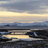 Buy canvas prints of Winter sunset over Þingvellir  by Claire Wade