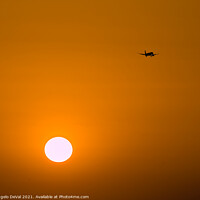 Buy canvas prints of Airplane Crossing the Skies at Sunset by Angelo DeVal