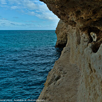 Buy canvas prints of Exploring the Cliffs in Carvalho Beach. Algarve by Angelo DeVal