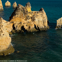 Buy canvas prints of Three Brothers Beach from the cliff in Algarve by Angelo DeVal