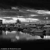 Buy canvas prints of Boats in a Cloudy Twilight at Faro Marina by Angelo DeVal