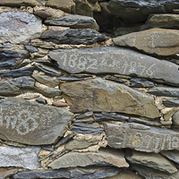 Buy canvas prints of Old schist wall with several dates from the 19th c by Angelo DeVal