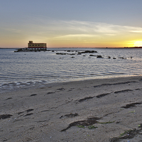 Buy canvas prints of Fuzeta beach sunset and landmark by Angelo DeVal