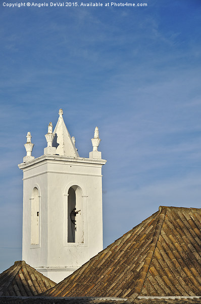 Church bell tower behind tiled roofs in Tavira  Picture Board by Angelo DeVal