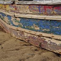 Buy canvas prints of Weathered Fishing Boat Resting on the Sand by Angelo DeVal