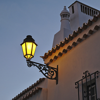Buy canvas prints of Warm Glow of Algarve Street Lamp by Angelo DeVal