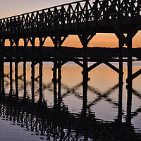 Buy canvas prints of Bridge silhouette at dusk in Quinta do Lago by Angelo DeVal