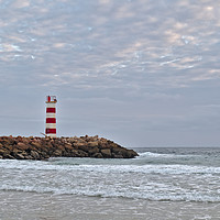 Buy canvas prints of Light tower and rocks in Ilha Deserta, Algarve by Angelo DeVal