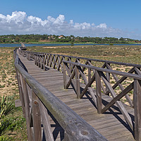 Buy canvas prints of Long wooden bridge of Quinta do Lago by Angelo DeVal