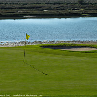 Buy canvas prints of Yellow flag on the Golf Course and Ria Formosa by Angelo DeVal