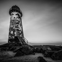 Buy canvas prints of Old Lighthouse in Monochrome  by Chris Evans