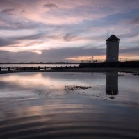 Buy canvas prints of Bateman's Tower reflected by Rob Woolf