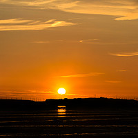 Buy canvas prints of Hilbre Island Sunset Silhouette  by David Chennell