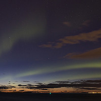 Buy canvas prints of Aurora Over Reykjavik by David Chennell
