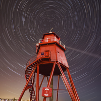 Buy canvas prints of   Herd Lighthouse With Star Trails  by Ray Pritchard