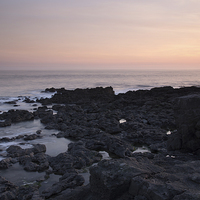 Buy canvas prints of Porthcawl, South Wales, UK, at sunset.  by Andrew Bartlett