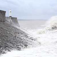 Buy canvas prints of  Porthcawl lighthouse, South Wales, UK, in a Storm by Andrew Bartlett