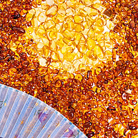 Buy canvas prints of Stones of yellow amber and a blue fan. by Andrey  Godyaykin