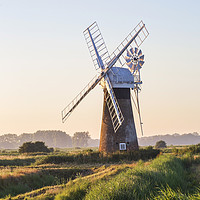 Buy canvas prints of Thurne windpump amongst the grass  by Sebastien Coell