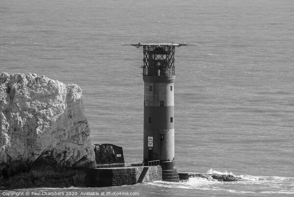The Needles Lighthouse is an active 19th century lighthouse on the outermost of the chalk rocks at The Needles on the Isle of Wight in the United Kingdom Picture Board by Paul Chambers